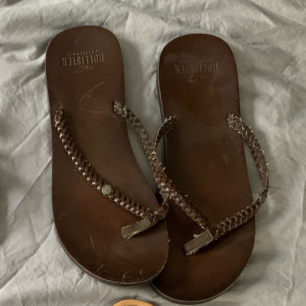 Brown leather flip flops